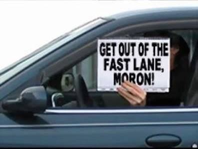 funny sign get out of the fast lane moron